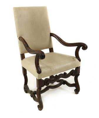Lot 393 - A French provincial walnut open armchairs