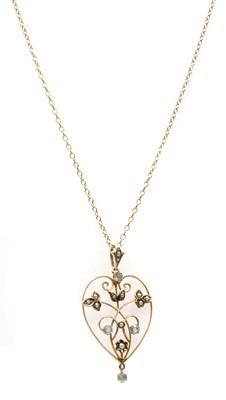 Lot 42 - A gold paste and split pearl pendant
