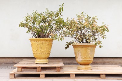 Lot 257 - A pair of yellow-glazed earthenware planters