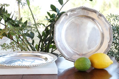 Lot 355 - A set of twelve silver George III soup plates