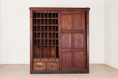 Lot 406 - A large pitch pine estate cupboard
