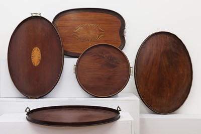 Lot 131 - Five brass-mounted serving trays