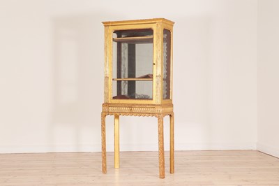 Lot 363 - A giltwood display cabinet on an integral base