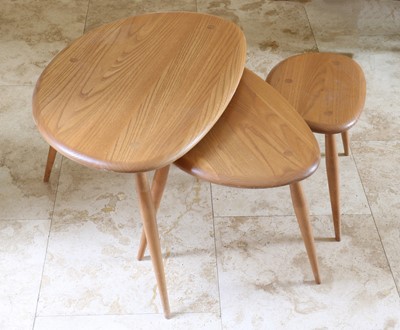 Lot 428 - A nest of three Ercol Pebble tables