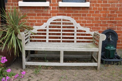 Lot 454 - A teak Lutyens garden bench