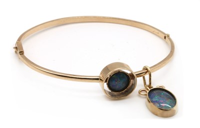 Lot 324 - A gold opal triplet bangle