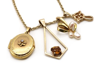 Lot 421 - A 9ct gold diamond set locket