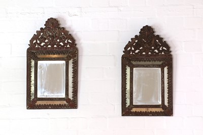 Lot 404 - A pair of Dutch pressed metal wall mirrors
