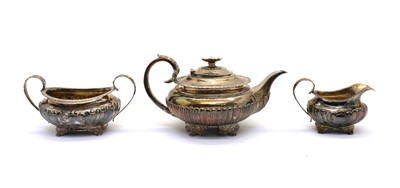 Lot 32 - A composed George IV silver three piece silver tea service