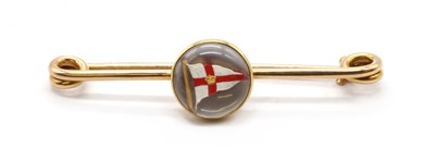 Lot 21 - A gold reverse painted crystal intaglio brooch