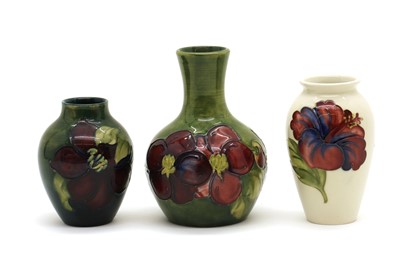 Lot 56 - A small Moorcroft pottery 'Hibiscus' pattern vase