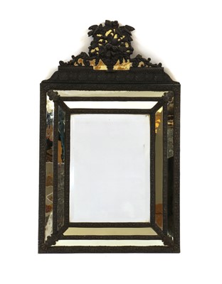 Lot 480 - A pressed brass cushioned framed mirror