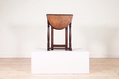 Lot 48 - An oak gateleg table of small proportions