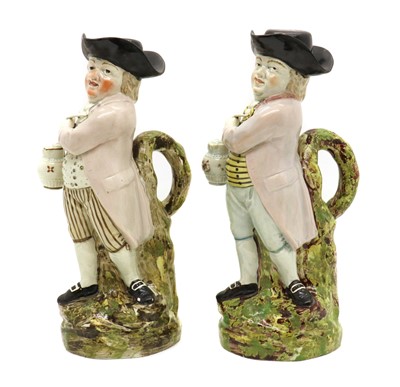 Lot 68 - A pair of prattware pottery 'Hearty Good Fellow' Toby jugs