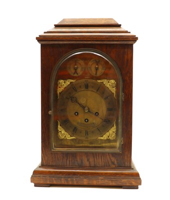 Lot 170 - An oak mantel clock
