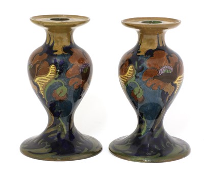 Lot 30 - A pair of Rozenburg den Haag candlesticks