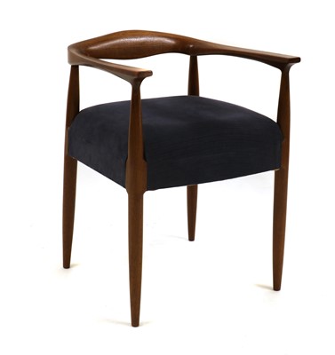 Lot 452 - A mid century teak elbow chair