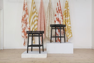 Lot 450 - A pair of rattan occasional tables by Paolo Moschino