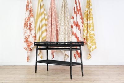 Lot 447 - A stained rattan side table by Paolo Moschino