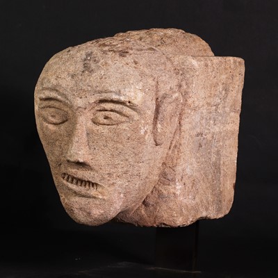 Lot 208 - A Celtic sandstone head with bared teeth