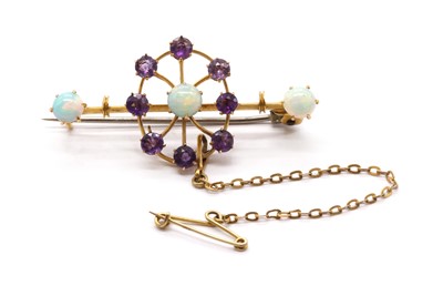 Lot 18 - An Edwardian gold opal and amethyst brooch