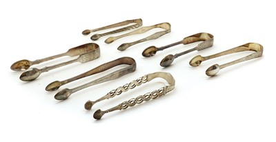 Lot 40 - A collection of seven George III and later silver sugar tongs
