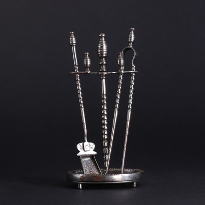 Lot 177 - A set of miniature polished steel fire irons and stand