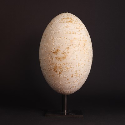 Lot 11 - A carved rhea egg