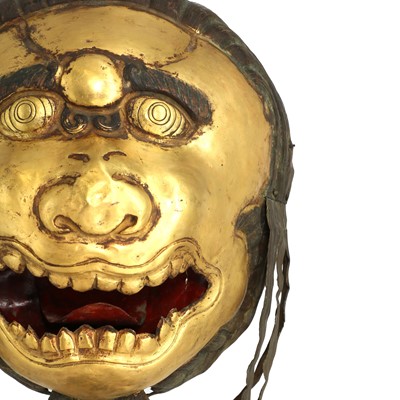 Lot 146 - A gilt-copper repoussé snow lion mask