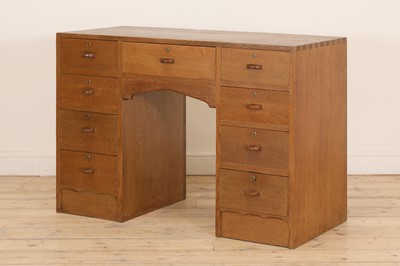 Lot 144 - A Cotswold School oak desk
