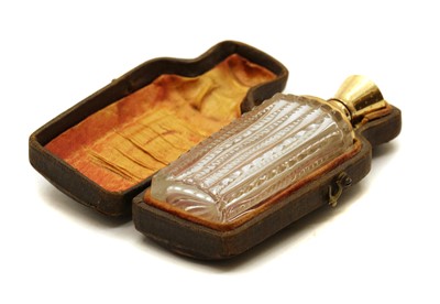 Lot 247 - A gold mounted cut glass scent bottle