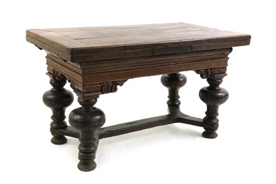 Lot 414 - An oak draw leaf table
