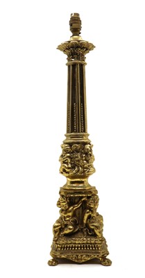 Lot 245 - A brass column form table lamp with cherub detail