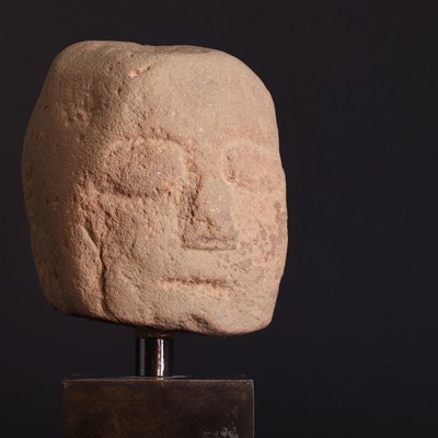 Lot 211 - A Celtic red sandstone ceremonial head