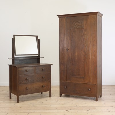 Lot 233 - An Heal's 'Tudor' oak wardrobe and dressing table