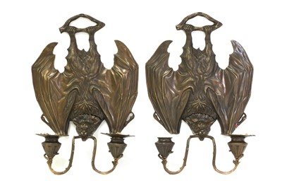 Lot 94 - A pair of cast metal bat wall lights