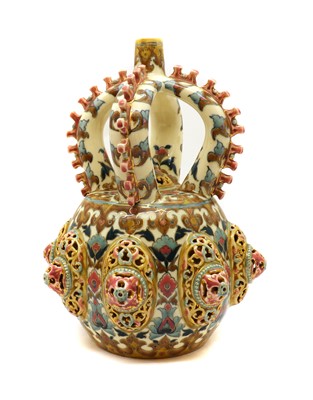 Lot 176 - A Hungarian Zsolnay-Pecs pottery four handled vase