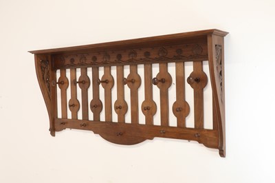 Lot 132 - An Arts and Crafts walnut coat rack