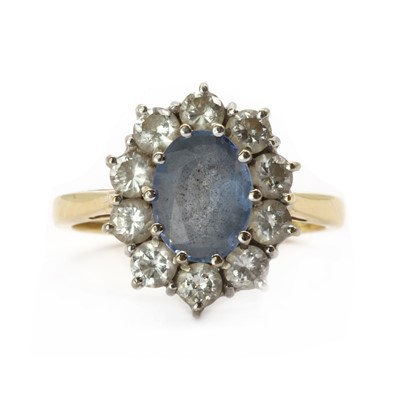 Lot 1278 - An 18ct gold sapphire and diamond cluster ring