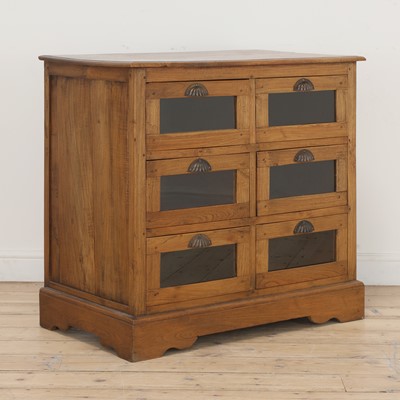 Lot 604 - An oak haberdashers chest