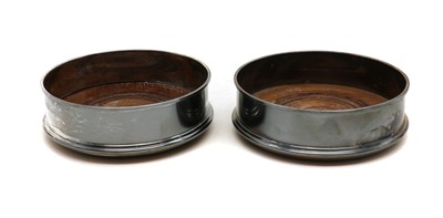 Lot 17 - A pair of silver wine coasters