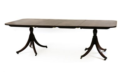 Lot 486 - A twin pedestal mahogany dining table