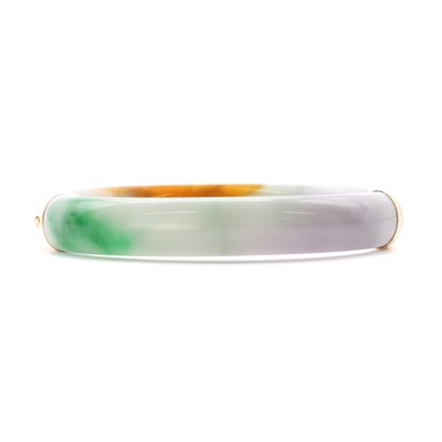 Lot 1304 - A 14ct gold mounted 'D' section jade hinged bangle