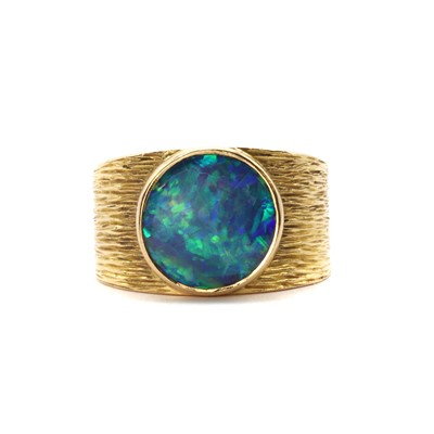 Lot 1324 - A gold single stone black opal ring