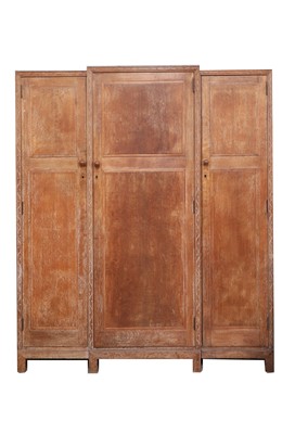 Lot 238 - A limed oak triple wardrobe