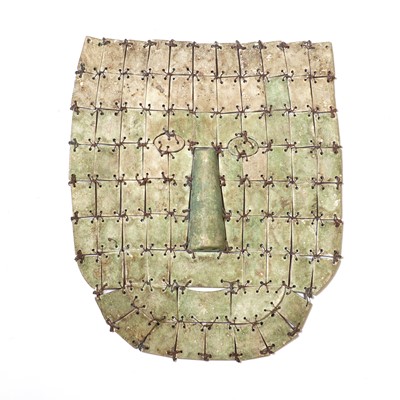 Lot 169 - An archaic Chinese jade or hardstone funerary mask