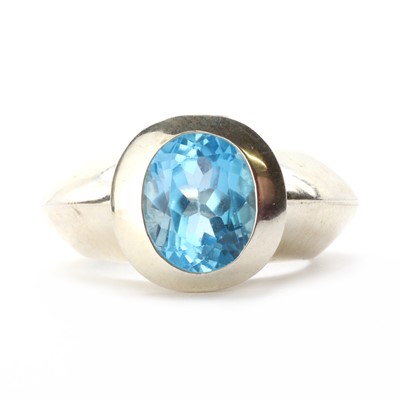 Lot 1254 - A sterling silver single stone blue topaz ring