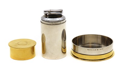 Lot 136 - An Hermès silver and gold plated novelty table lighter