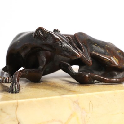 Lot 194 - A Regency bronze figure of a resting greyhound