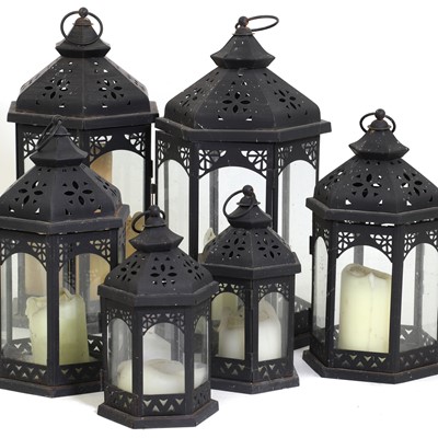 Lot 503 - A group of five iron garden lanterns